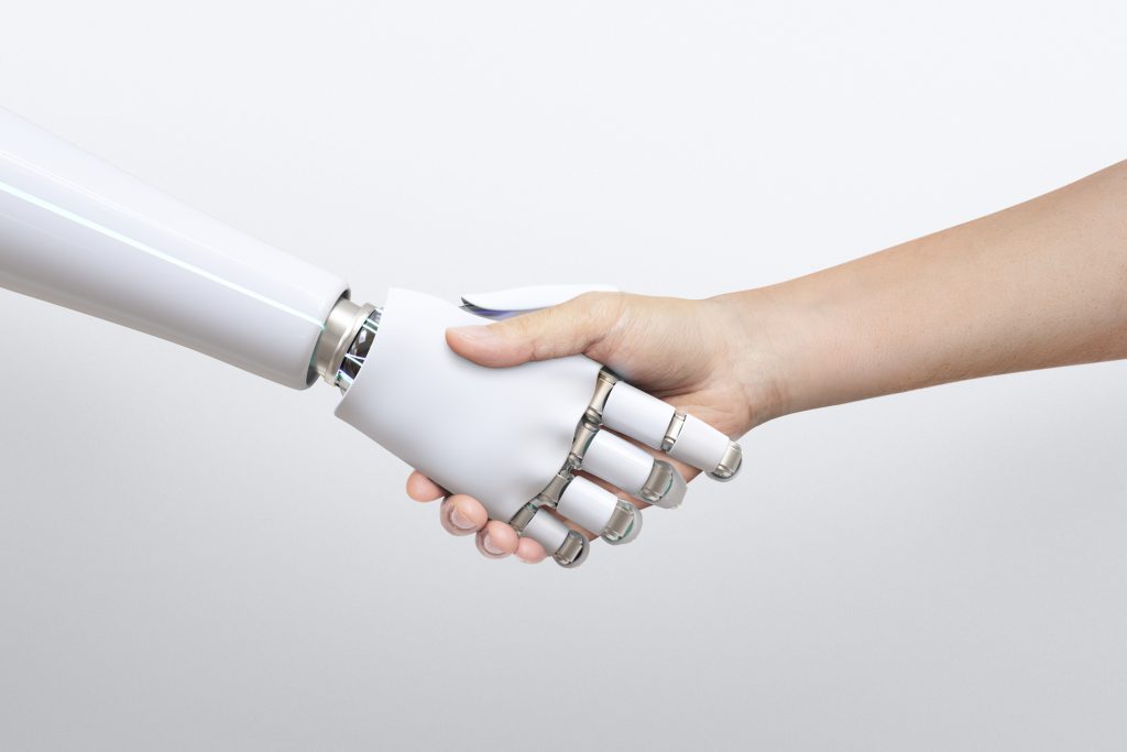 A robot shaking hand with human hand